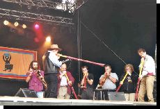 Charlie and 6 students on the Main stage: Ian, Roland, Kris, Ricardo, Celinda and Wim
